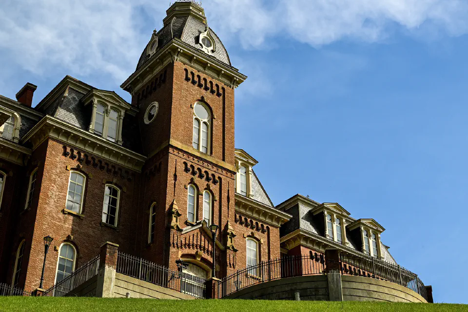 The west side of Woodburn Hall is seen from a low angle as the sky clears after a thunderstorm in Morgantown, WV, Wednesday, April 1, 2026.